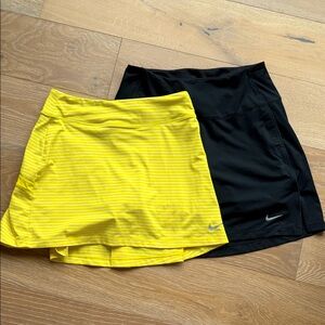 Bundle of 2 Nike Women's Striped Yellow and Solid Black golf Skirts